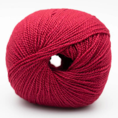Wollknäuel in tiefem magenta mit Strickgarn-Textur und runder Mittelöffnung