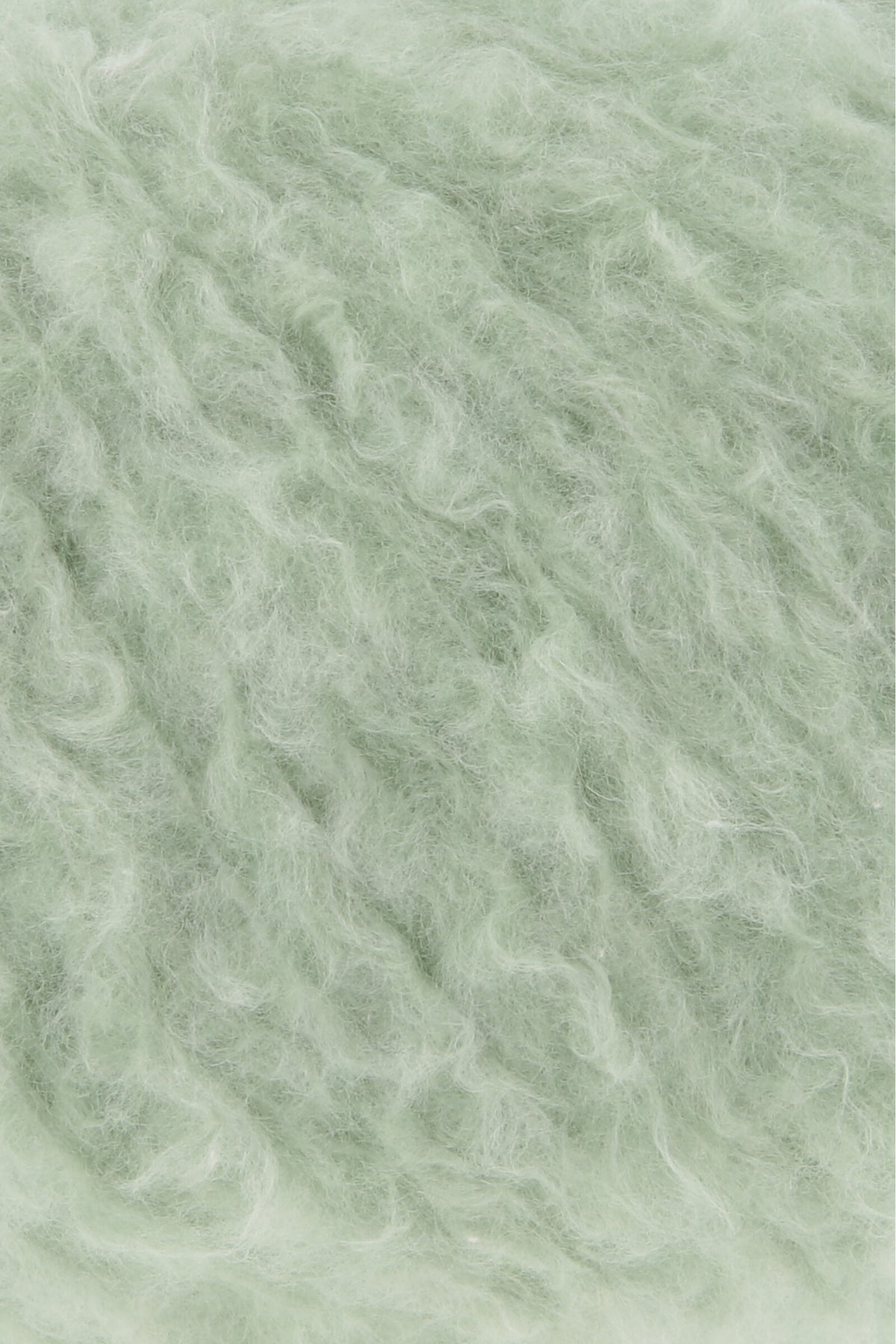 Piuma-Wollgarn in hellgrüner Flauschfaser-Textur, Nahaufnahme