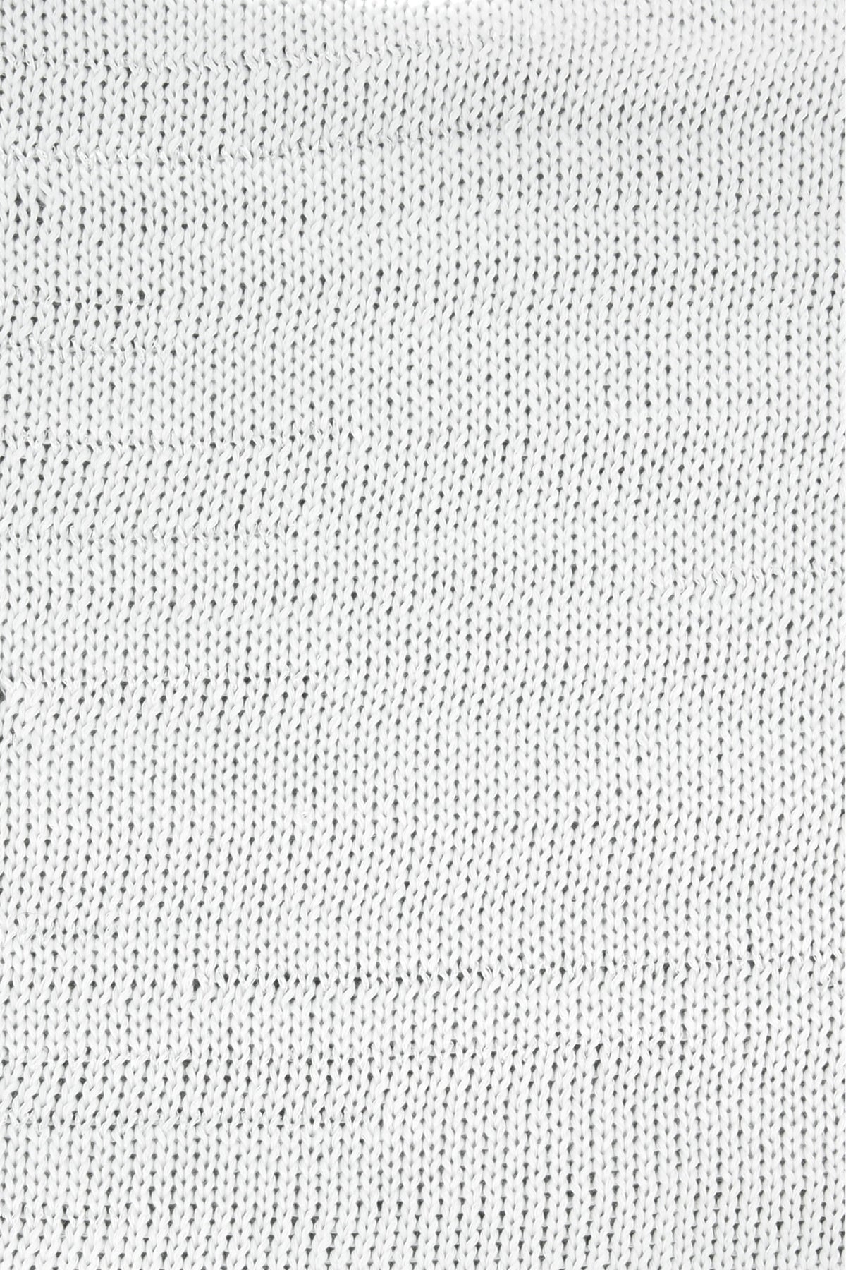 Strickstoff aus weißem Garn, feines Maschenbild im Detail